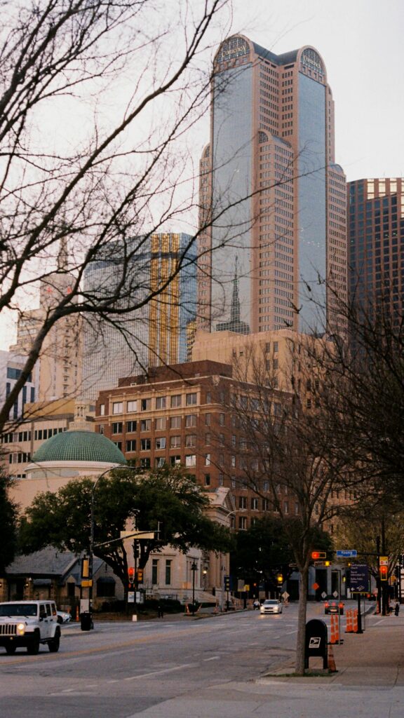 A scenic view of Dallas's downtown district showcasing skyscrapers and urban streets.